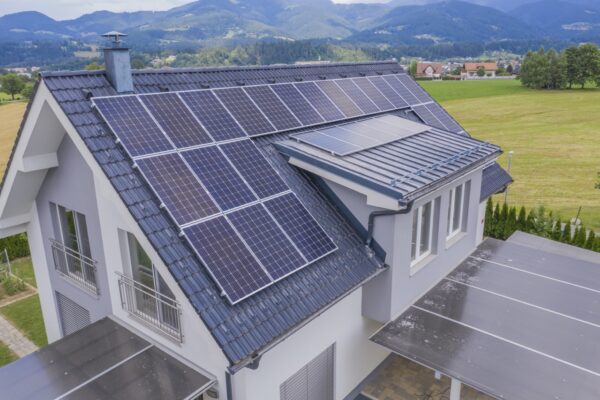 Aerial view private house with solar panels roof groot